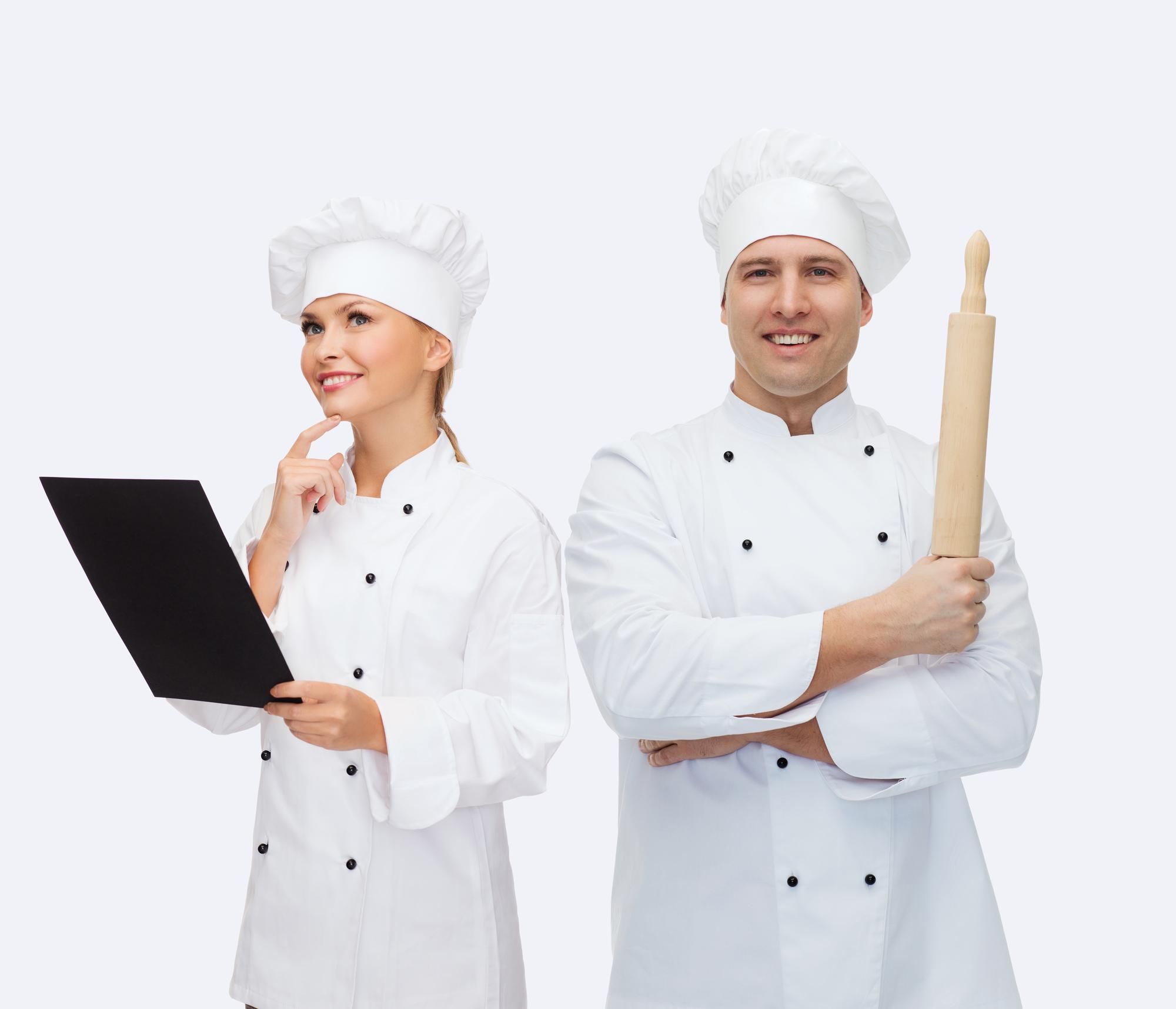 Chef instructing team in kitchen